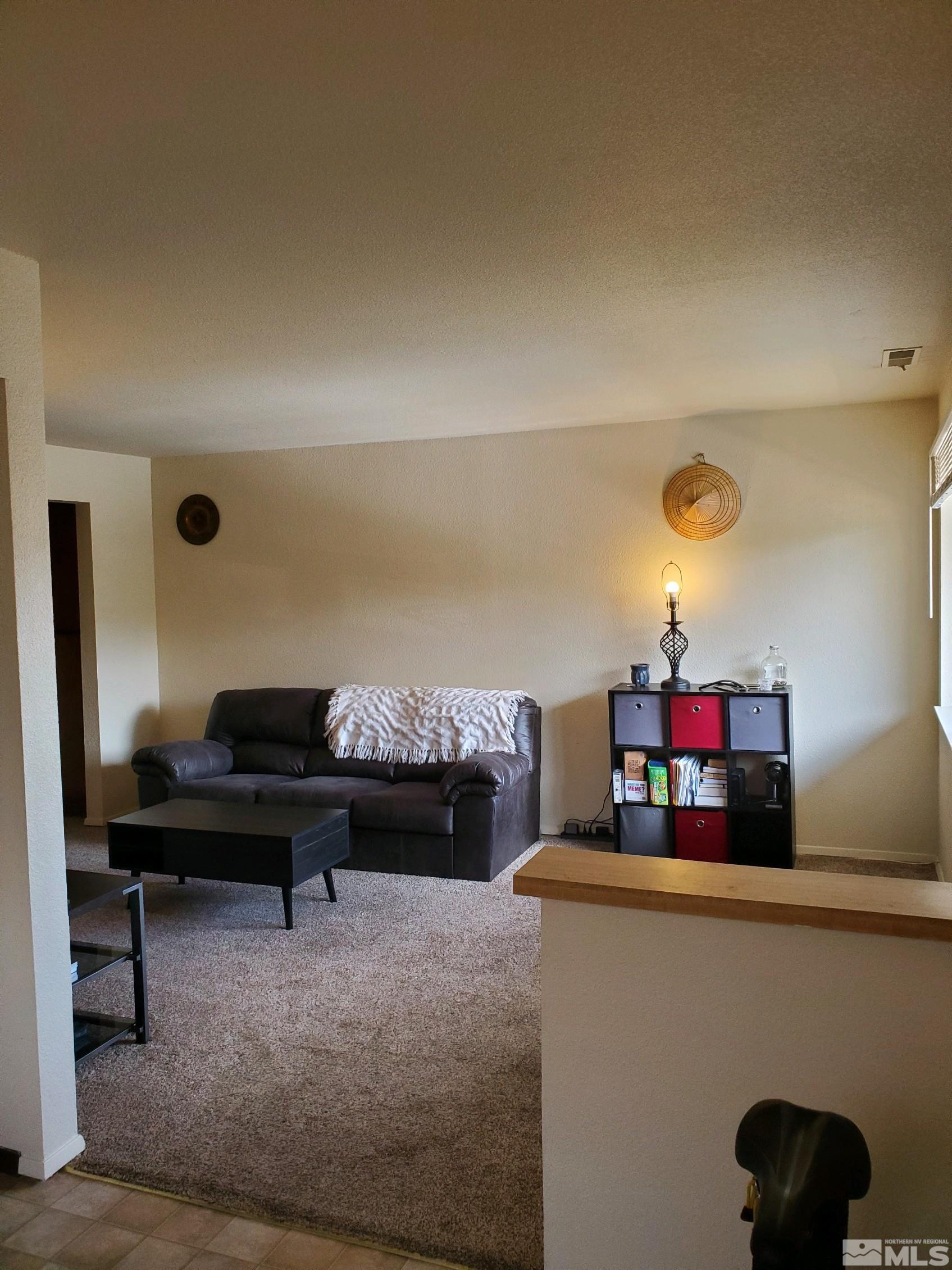 3575 Gypsum Road Reno, NV 89503 - Photo 28 of 32 a living room with furniture and a mirror