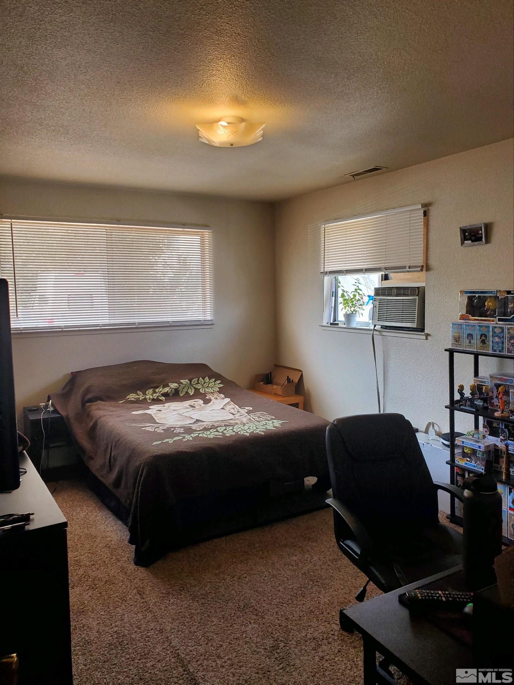 3575 Gypsum Road Reno, NV 89503 - Photo 31 of 32 a bedroom with a bed and a window