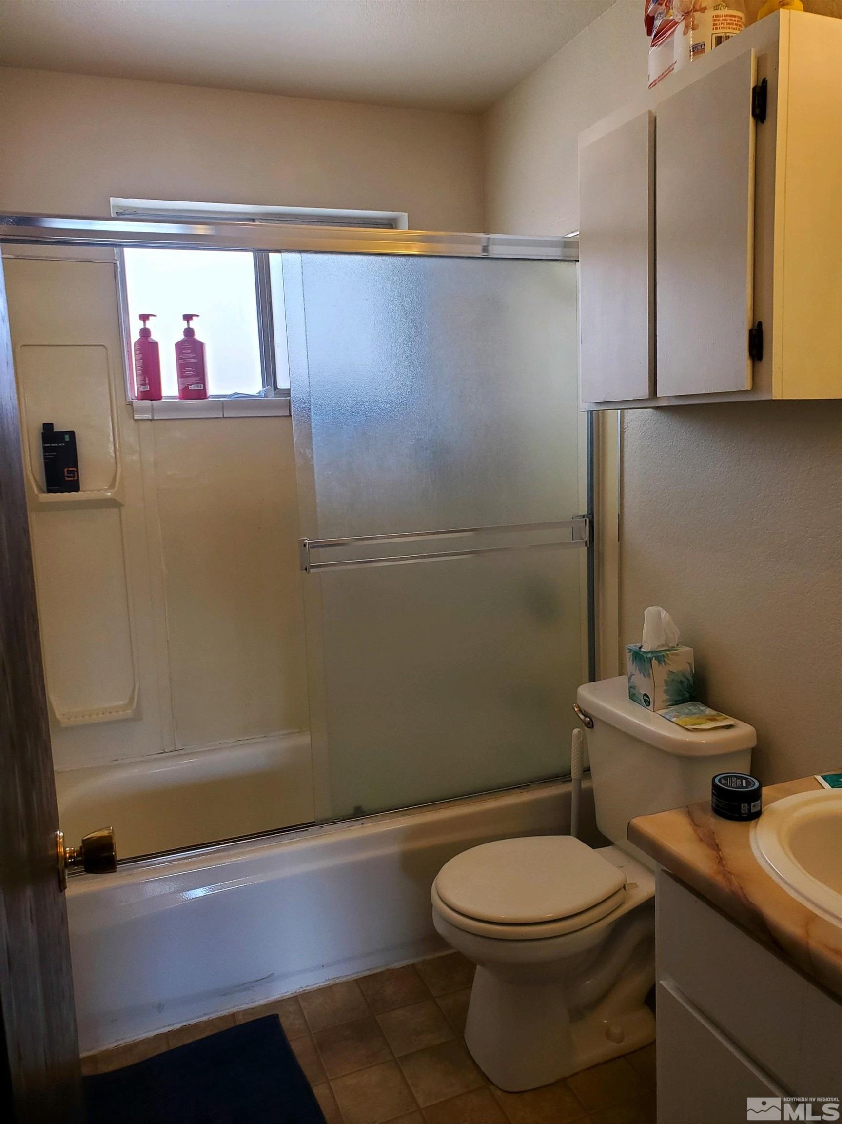 3575 Gypsum Road Reno, NV 89503 - Photo 32 of 32 a bathroom with a sink a toilet and shower