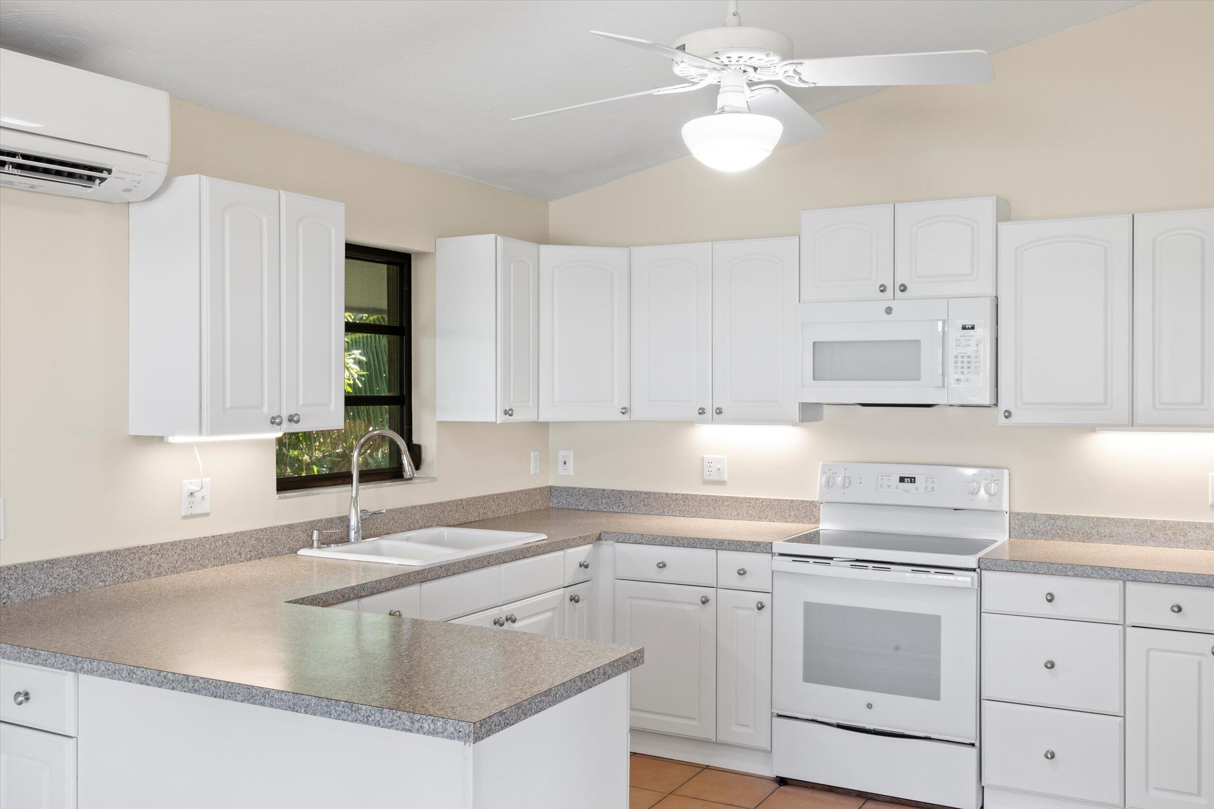 3714 Pine Street Big Pine Key, FL 33043 - Photo 11 of 64 a kitchen with appliances cabinets and a sink