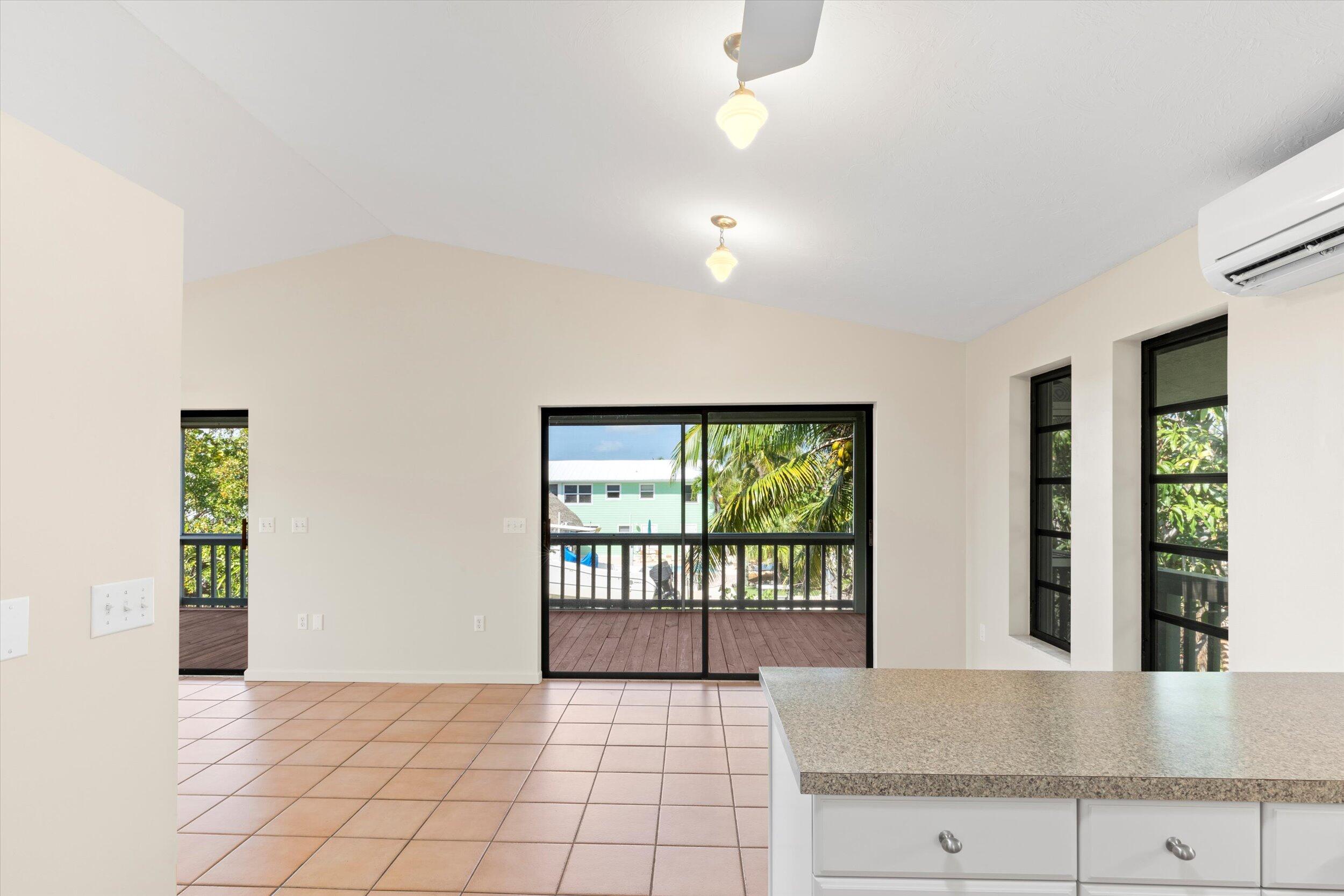 3714 Pine Street Big Pine Key, FL 33043 - Photo 14 of 64 a view of an entryway with wooden floor and a window