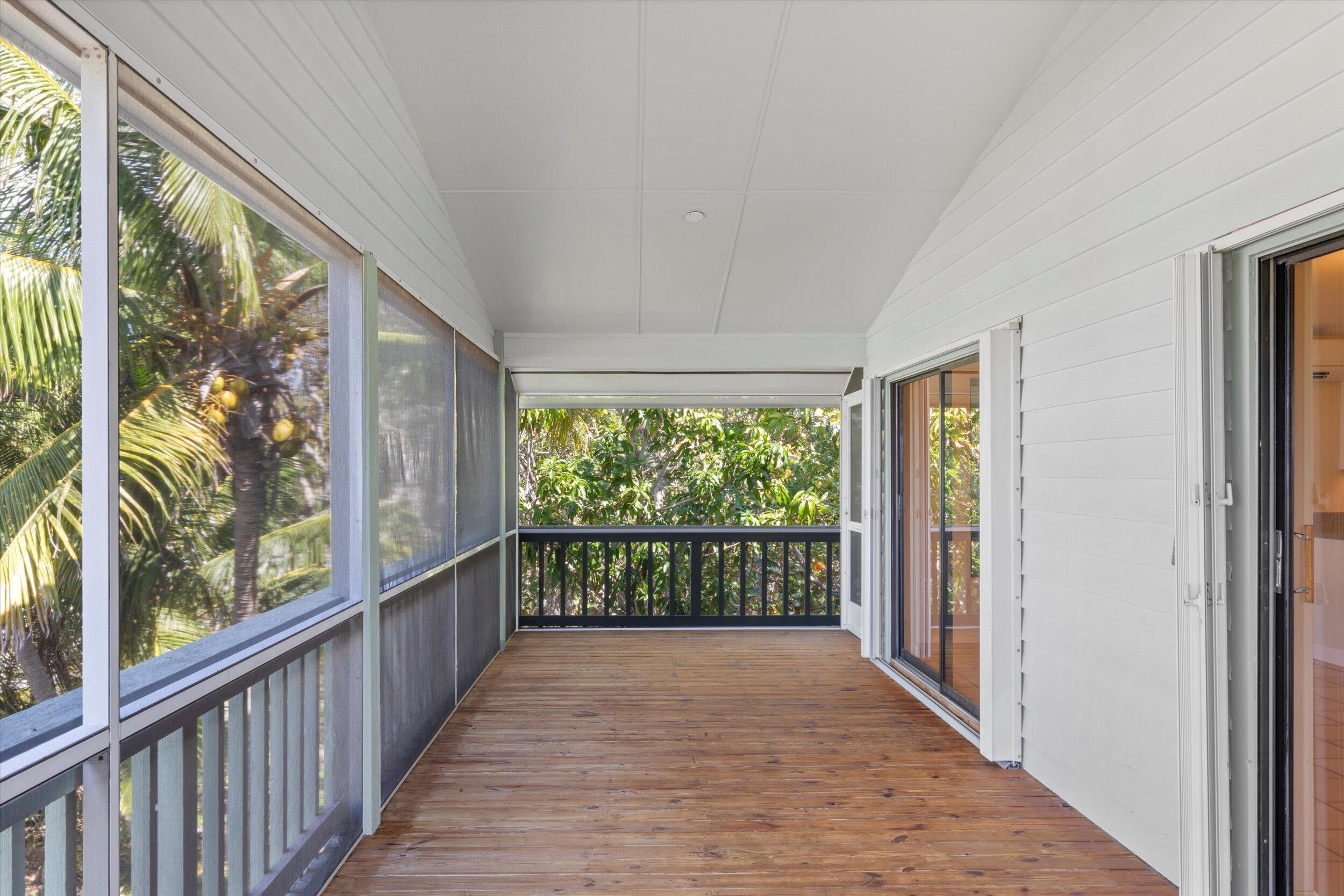 3714 Pine Street Big Pine Key, FL 33043 - Photo 17 of 64 a view of a room with wooden floor and large windows