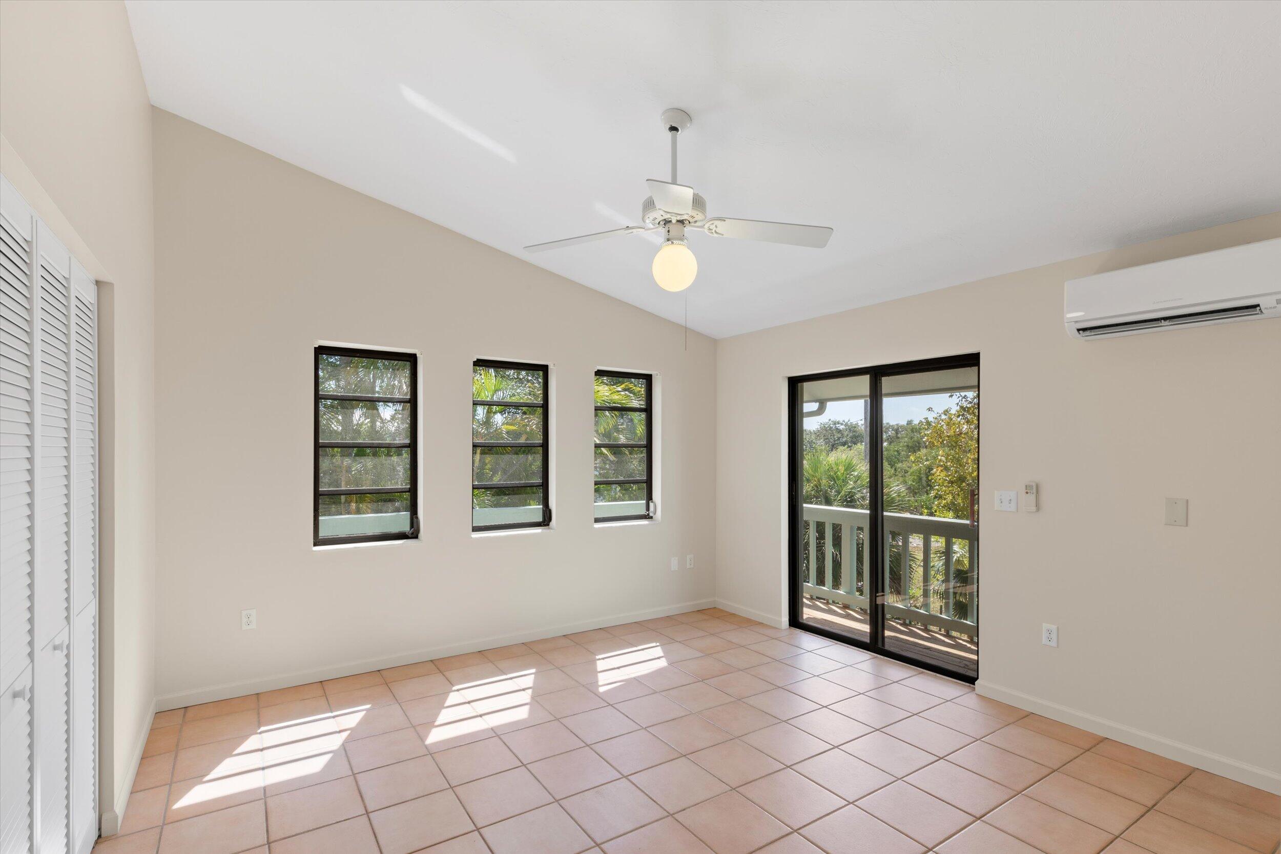 3714 Pine Street Big Pine Key, FL 33043 - Photo 23 of 64 a view of an empty room with windows and fan