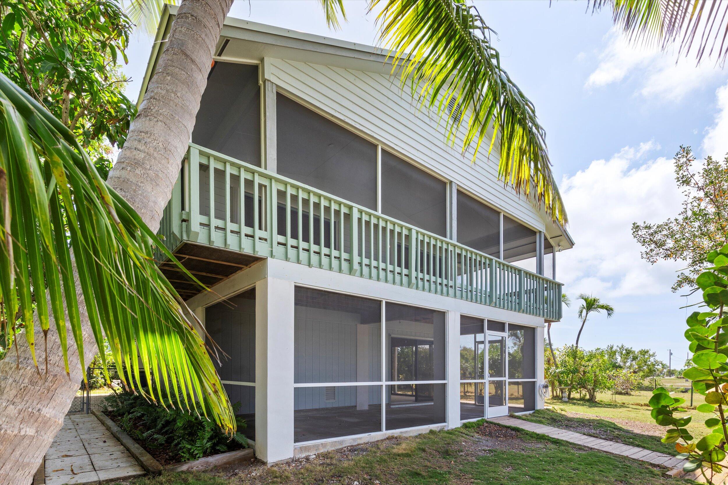 3714 Pine Street Big Pine Key, FL 33043 - Photo 37 of 64 a view of a house with a yard and plants