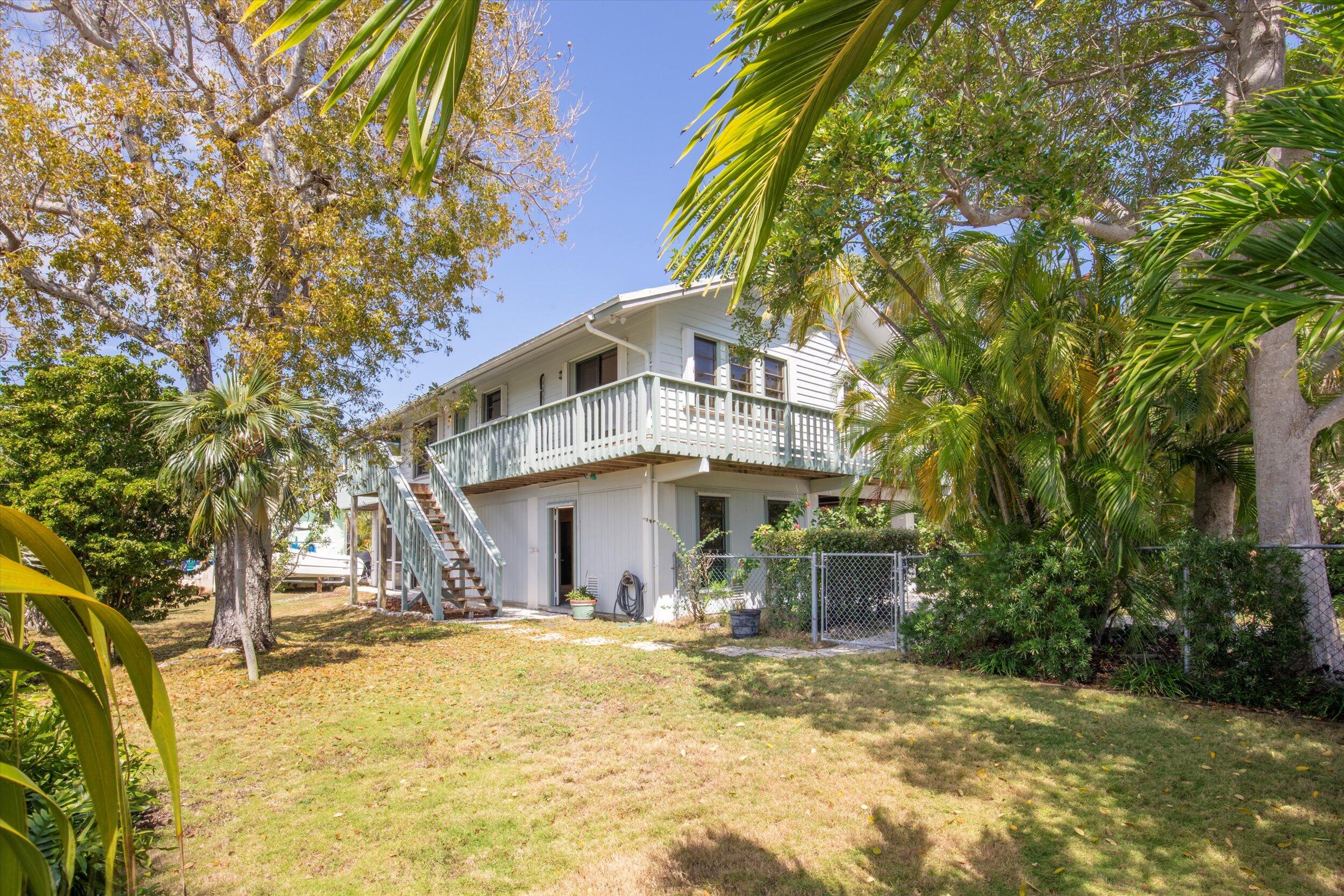 3714 Pine Street Big Pine Key, FL 33043 - Photo 42 of 64 a front view of a house with a yard