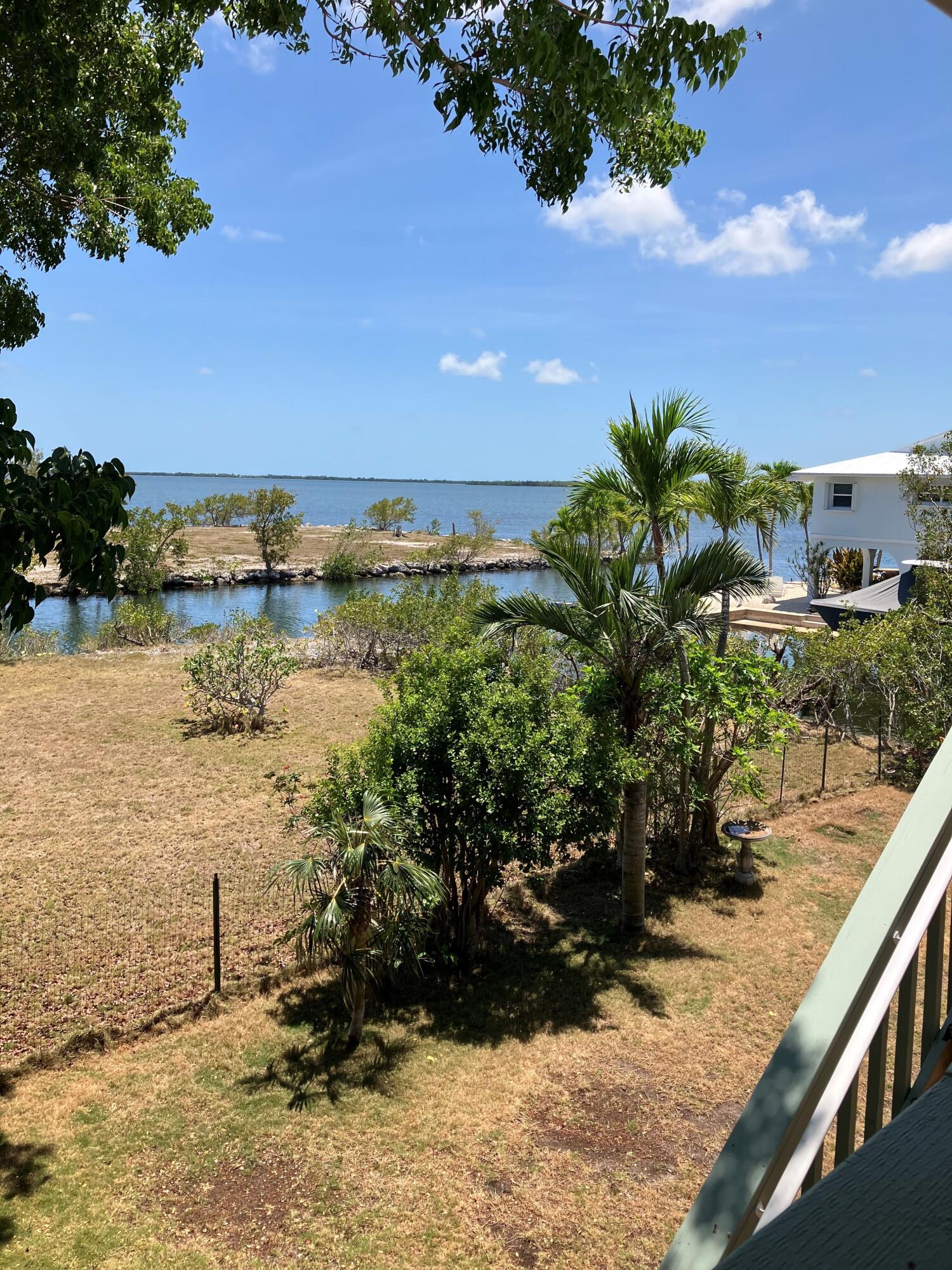 3714 Pine Street Big Pine Key, FL 33043 - Photo 43 of 64 a view of a lake with a yard