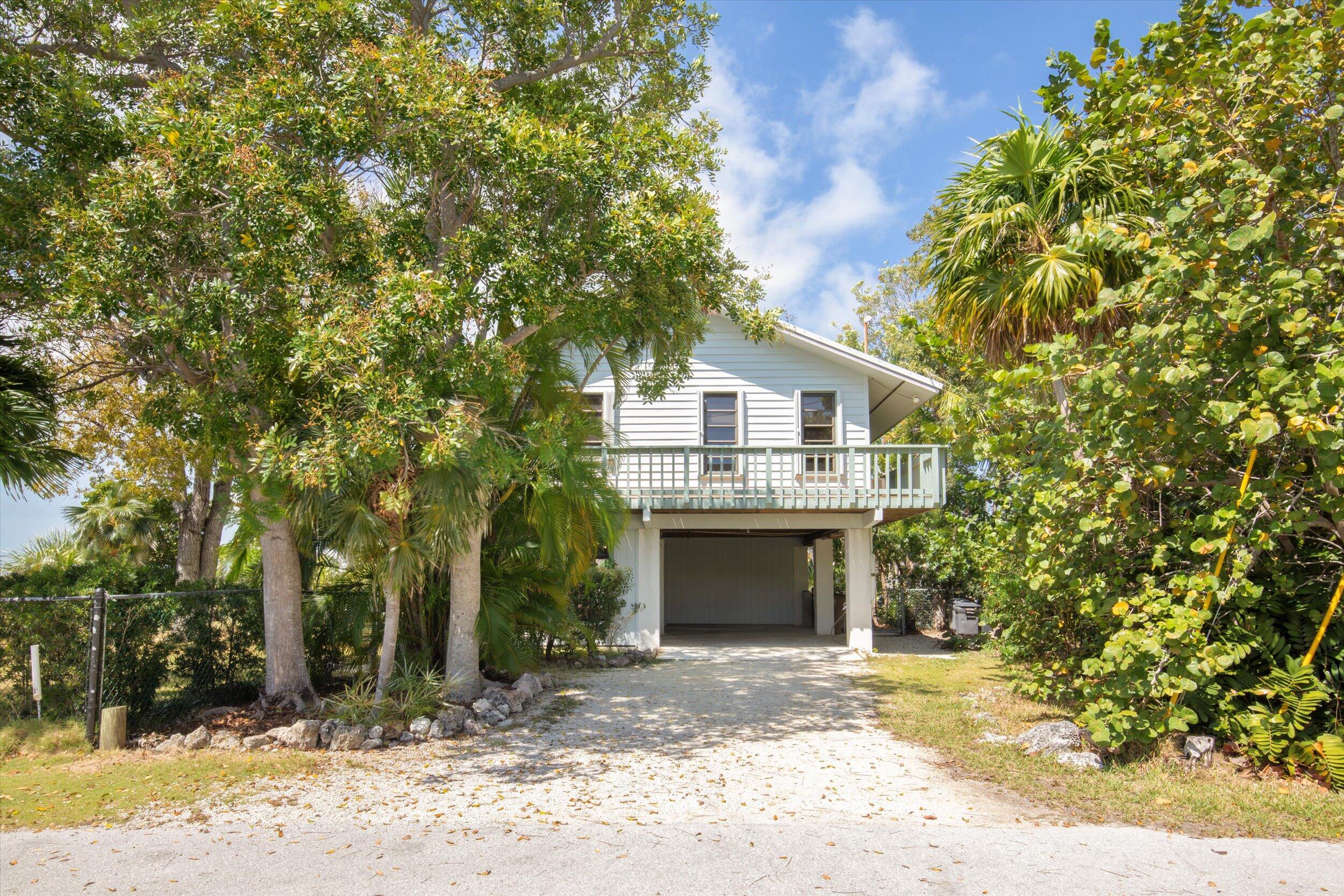 3714 Pine Street Big Pine Key, FL 33043 - Photo 44 of 64 a view of house with outdoor space and trees
