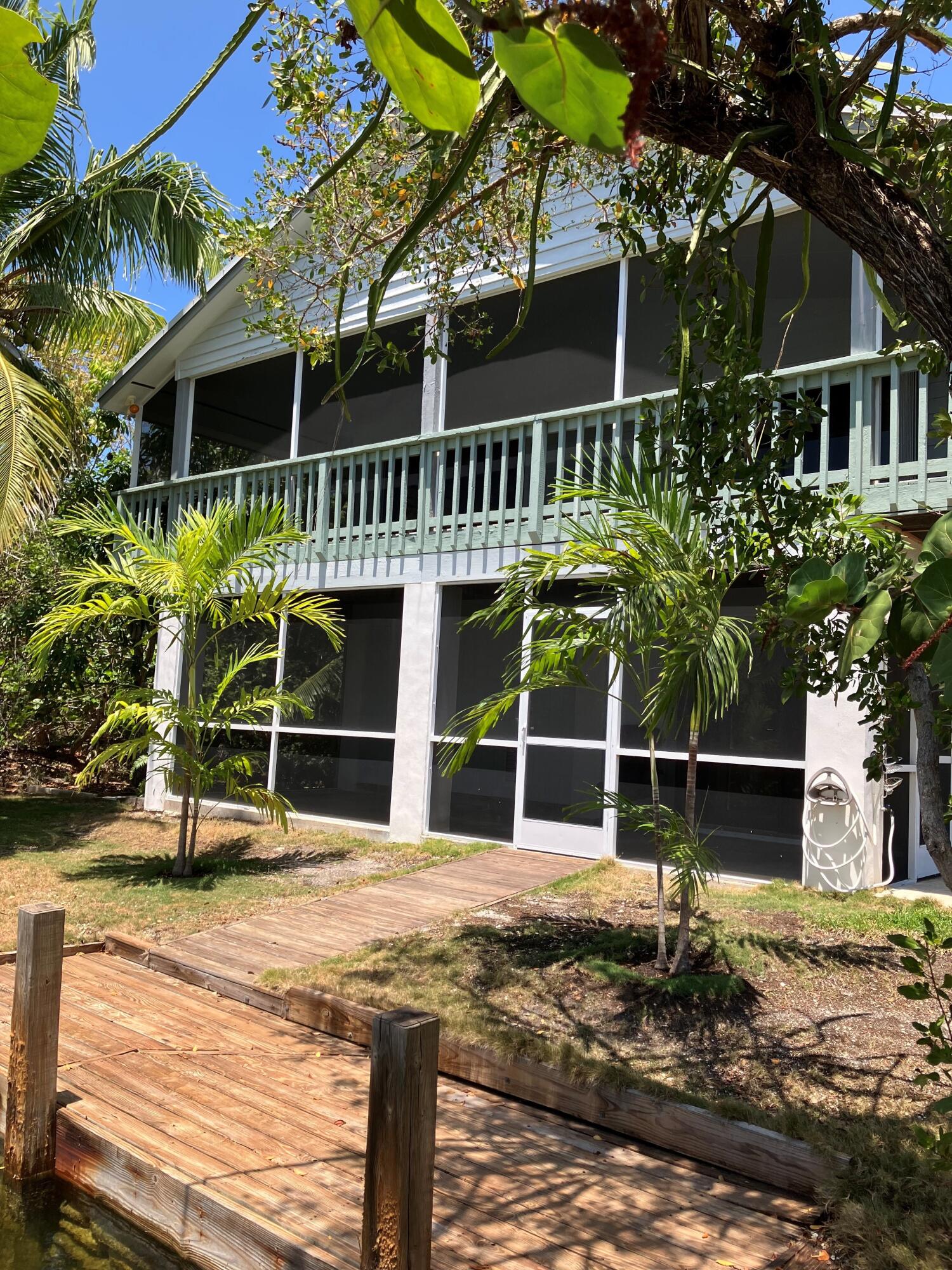 3714 Pine Street Big Pine Key, FL 33043 - Photo 45 of 64 a house with trees in front of it