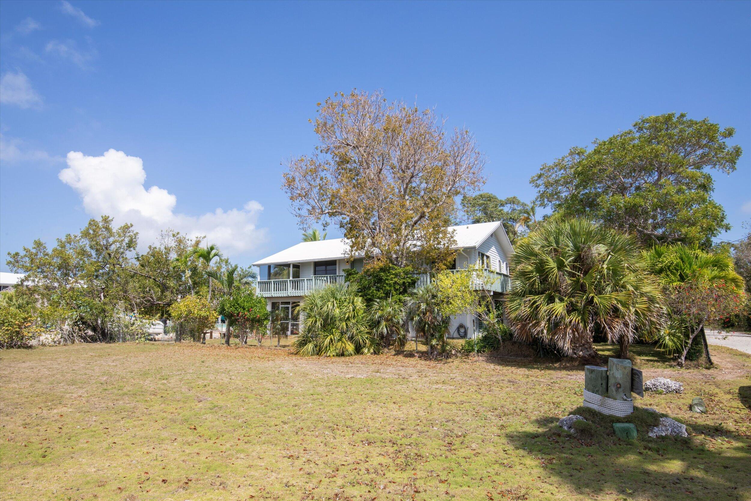 3714 Pine Street Big Pine Key, FL 33043 - Photo 46 of 64 a front view of a house with a yard and tree s