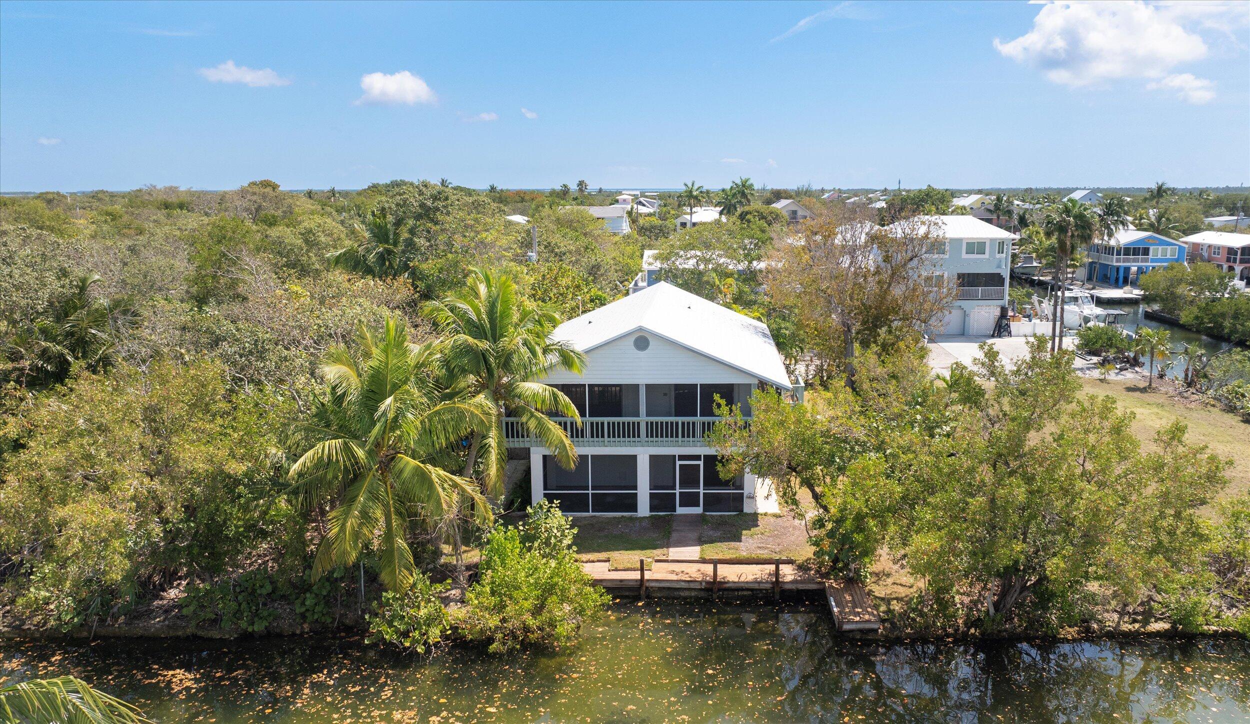 3714 Pine Street Big Pine Key, FL 33043 - Photo 59 of 64 a view of a house with a yard and sitting area