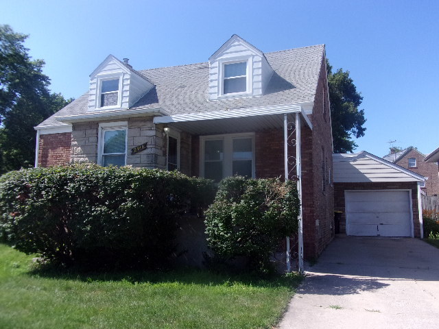 2918 Ridge Road Lansing, IL 60438 - Photo 1 of 7 a front view of a house with a garden