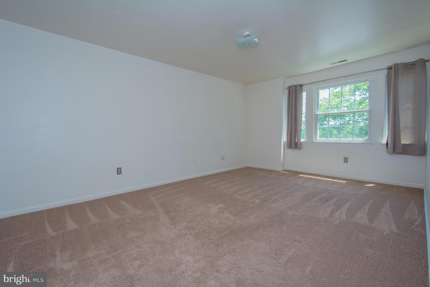 8335 Montgomery Run Road, Unit H Ellicott City, MD 21043 - Photo 12 of 22 an empty room with a window