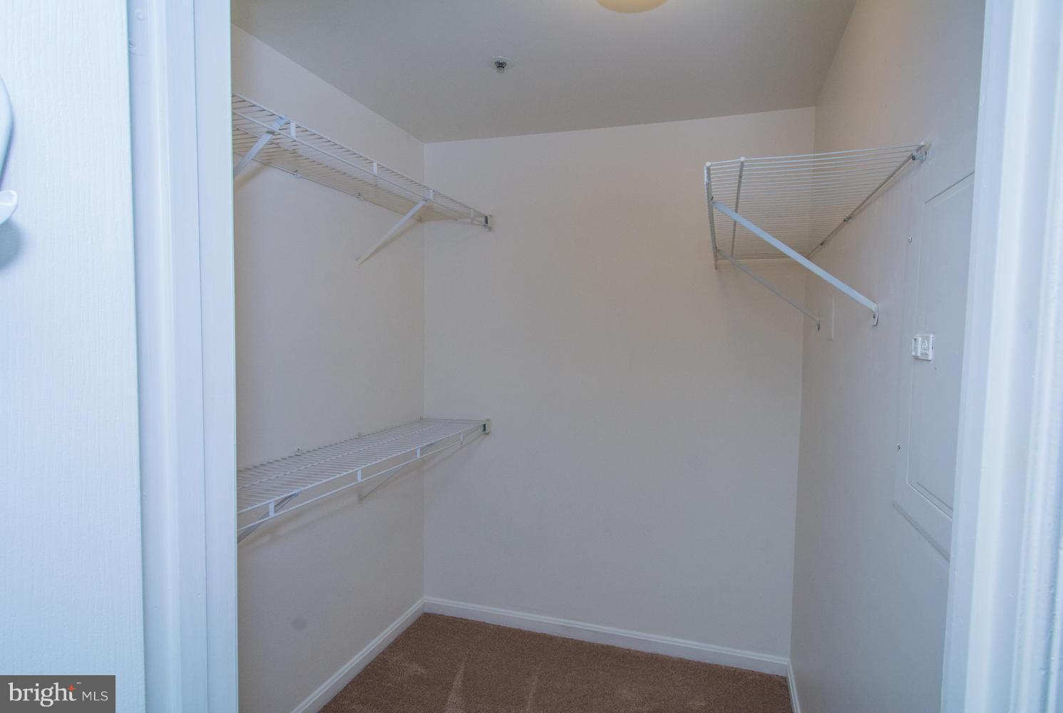 8335 Montgomery Run Road, Unit H Ellicott City, MD 21043 - Photo 13 of 22 a view of an empty walk in closet