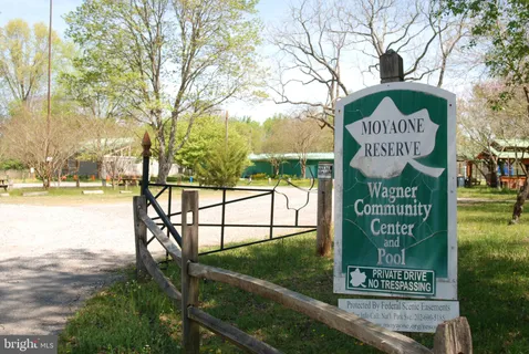 a backyard of a house with barbeque oven