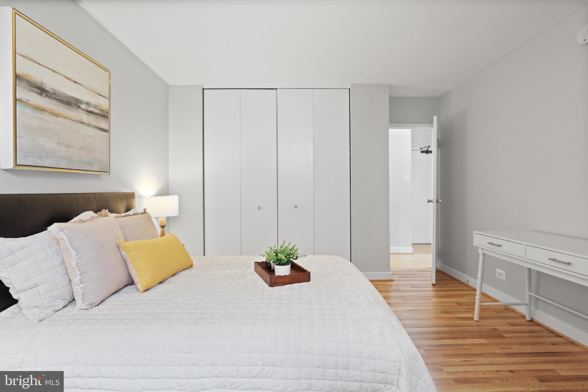 1260 21st Street Northwest, Unit 108 Washington, DC 20036 - Photo 16 of 23 a bedroom with a bed and walk in closet