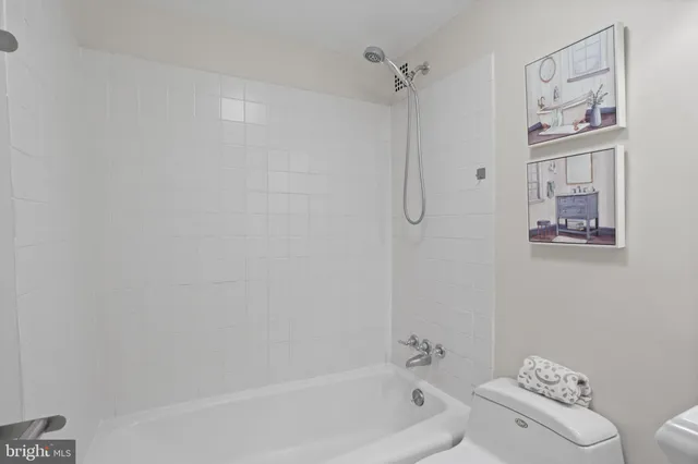 a bathroom with a bathtub and shower