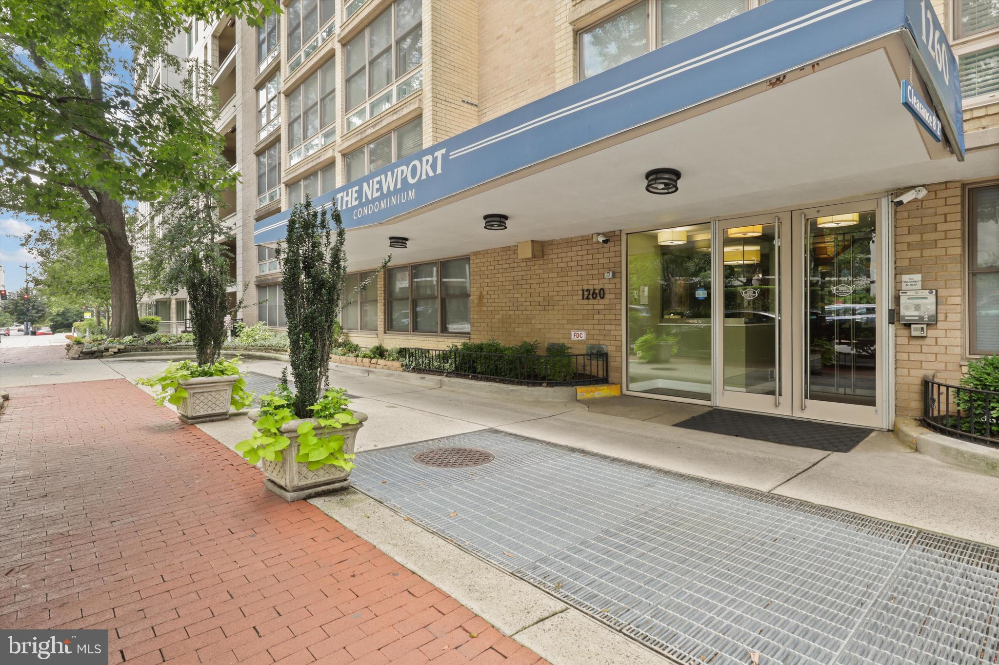 1260 21st Street Northwest, Unit 108 Washington, DC 20036 - Photo 4 of 23 a front view of a building with a garden