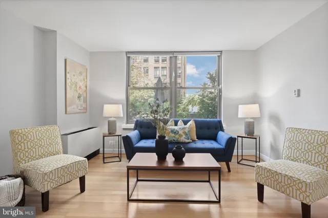 a living room with furniture and a window