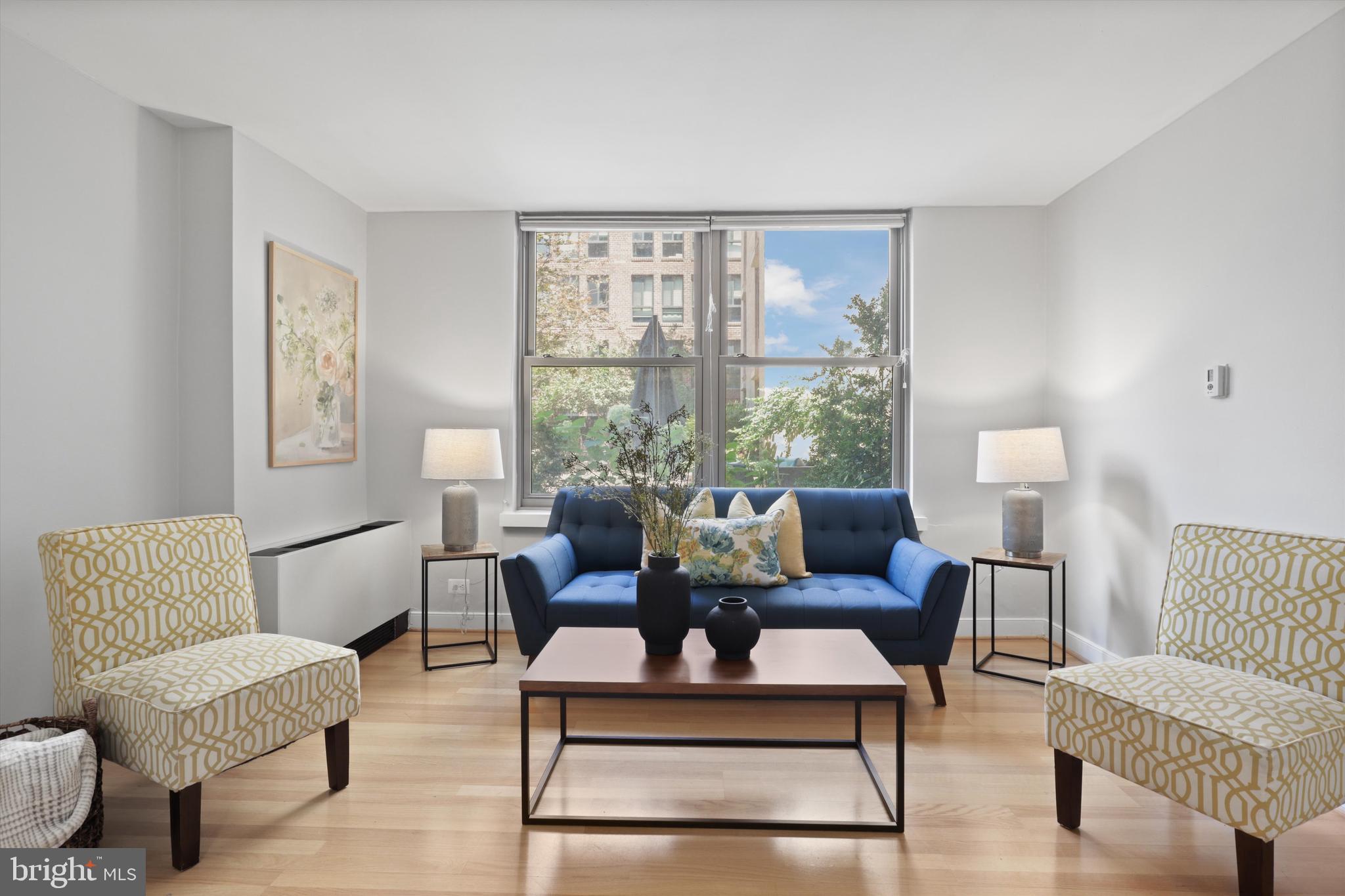 1260 21st Street Northwest, Unit 108 Washington, DC 20036 - Photo 7 of 23 a living room with furniture and a window
