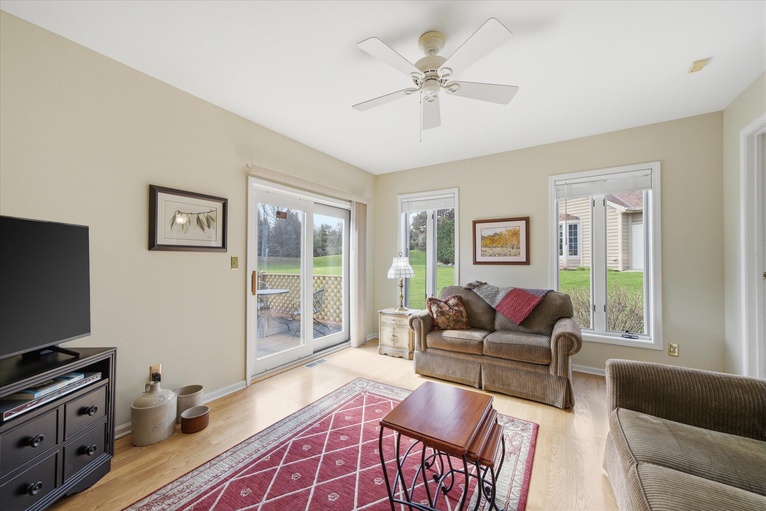 W268-n1935 Shooting Star Road, Unit B Pewaukee, WI 53072 - Photo 24 of 41 Family Room w/Slider to Deck