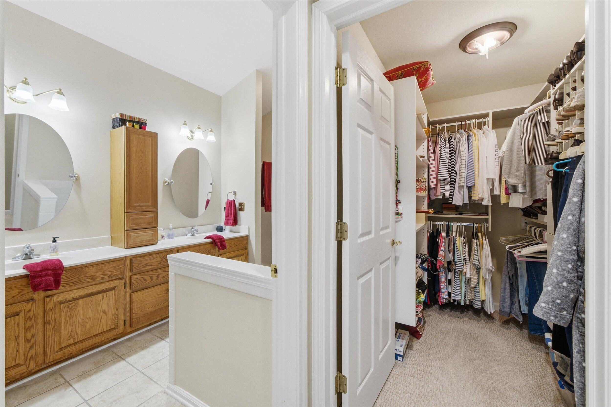 W268-n1935 Shooting Star Road, Unit B Pewaukee, WI 53072 - Photo 30 of 41 Walk-in Closet & Bathroom