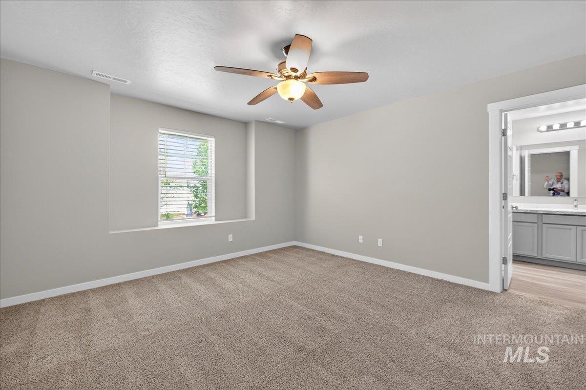 2505 East Goldstone Street Meridian, ID 83642 - Photo 14 of 28 Spacious room featuring neutral carpet flooring, light-toned walls, and a window with blinds