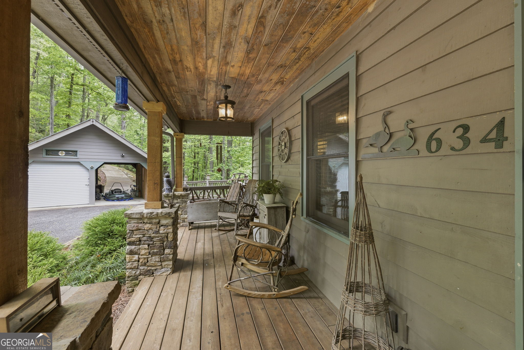 634 Little Hawk Road Sautee Nacoochee, GA 30571 - Photo 3 of 54 a view of balcony with chairs and wooden floor
