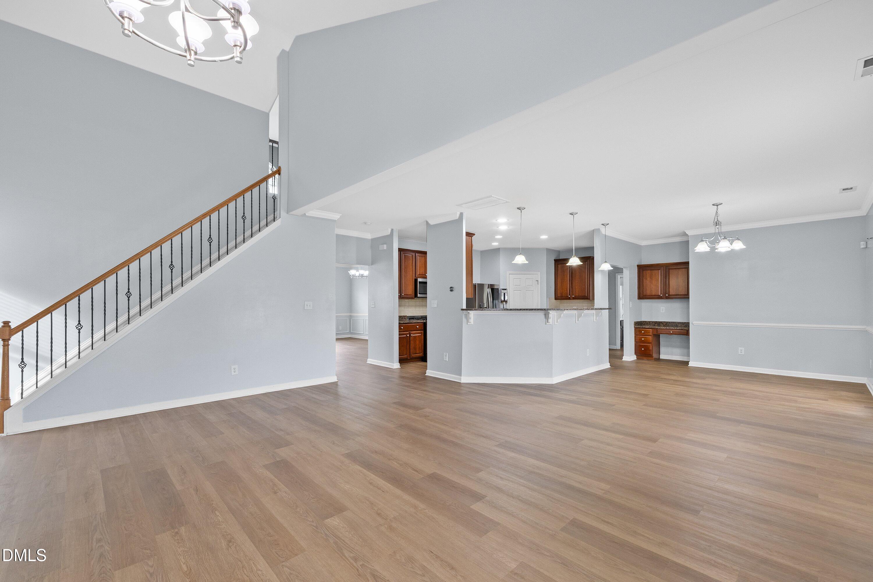 508 Arbor Crest Road Holly Springs, NC 27540 - Photo 12 of 45 a view of a kitchen with wooden floor and a kitchen space