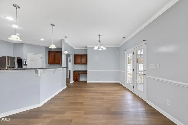 a view of a kitchen with a sink and microwave