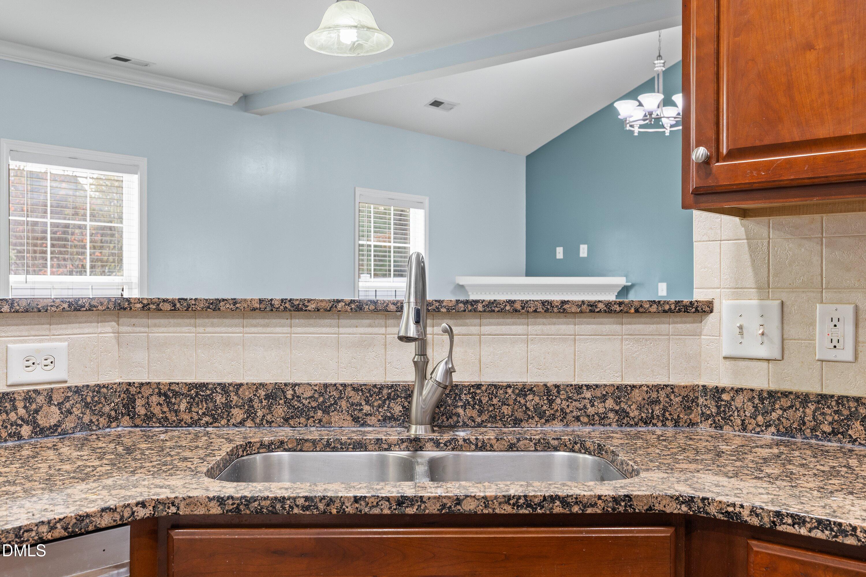 508 Arbor Crest Road Holly Springs, NC 27540 - Photo 21 of 45 a kitchen with granite countertop a sink and a granite counter tops