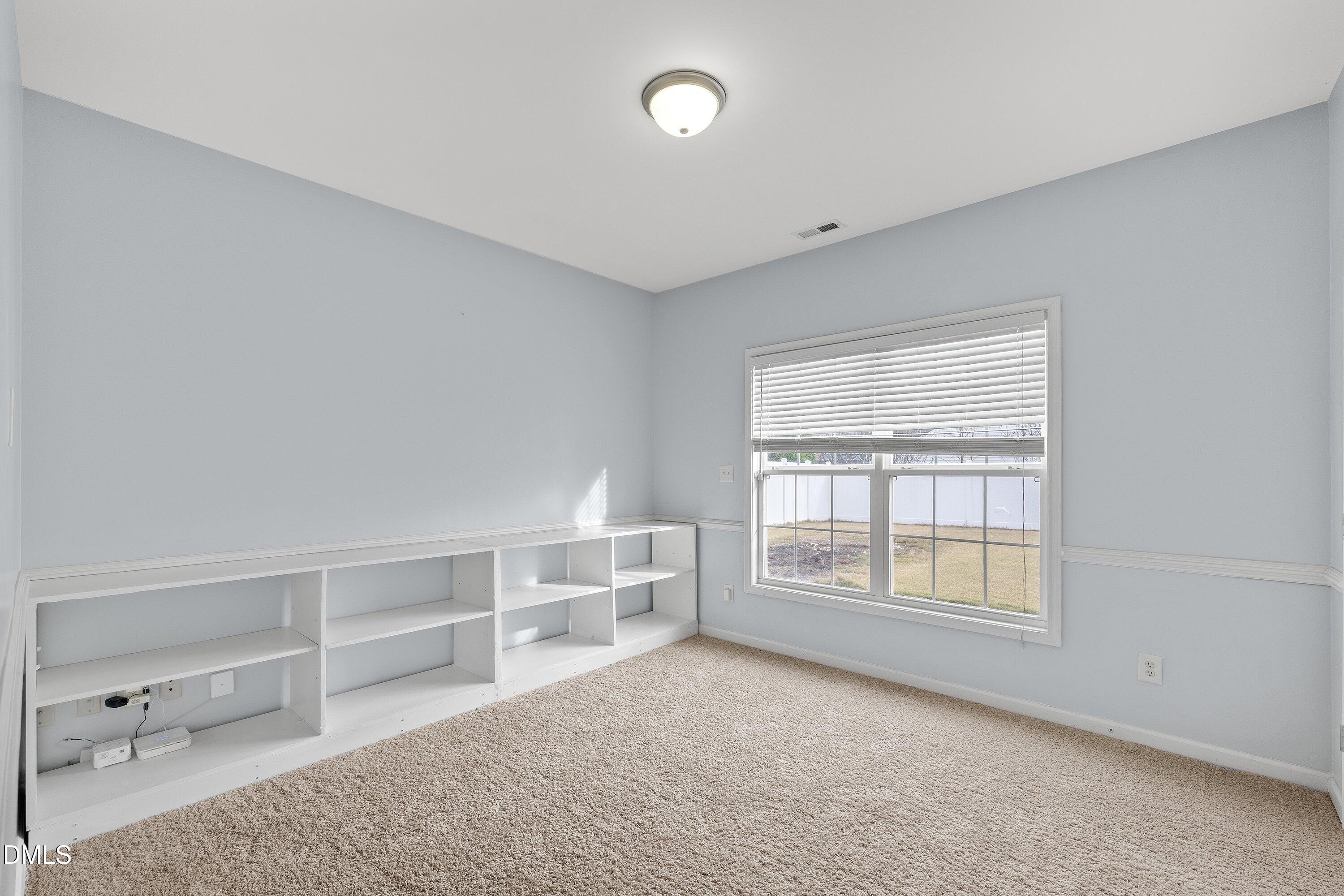 508 Arbor Crest Road Holly Springs, NC 27540 - Photo 23 of 45 a view of an empty room with a window