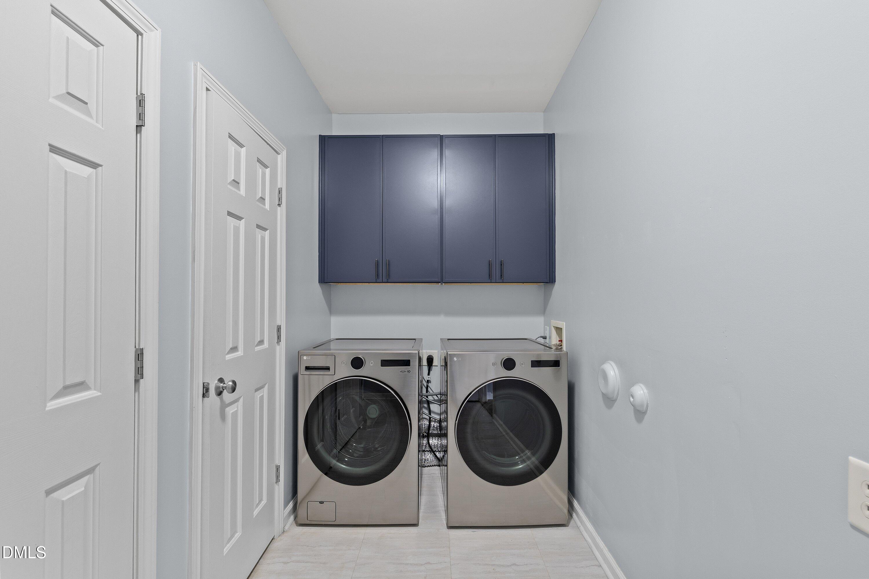 508 Arbor Crest Road Holly Springs, NC 27540 - Photo 24 of 45 a utility room with dryer and washer
