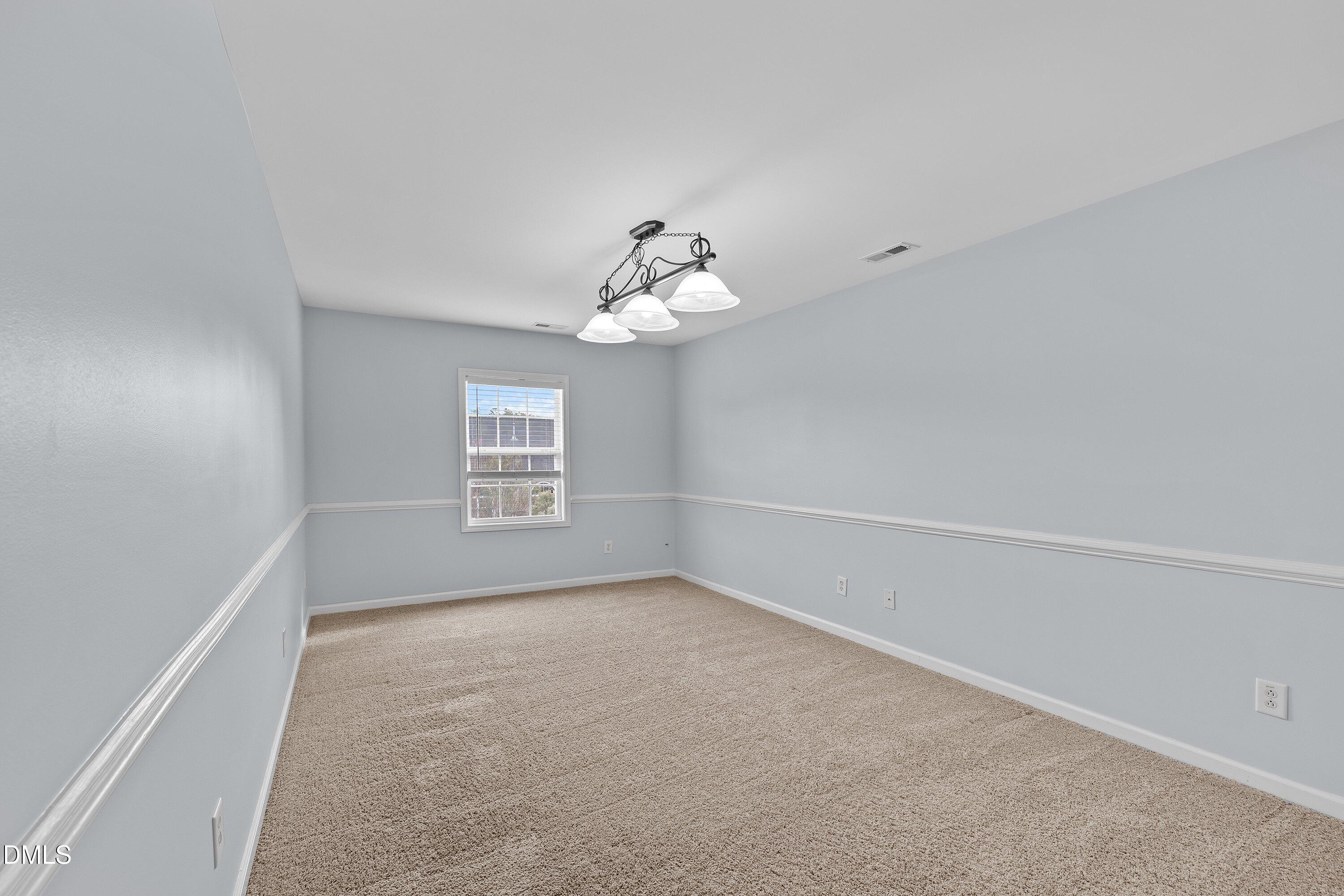 508 Arbor Crest Road Holly Springs, NC 27540 - Photo 26 of 45 wooden floor in an empty room with a window