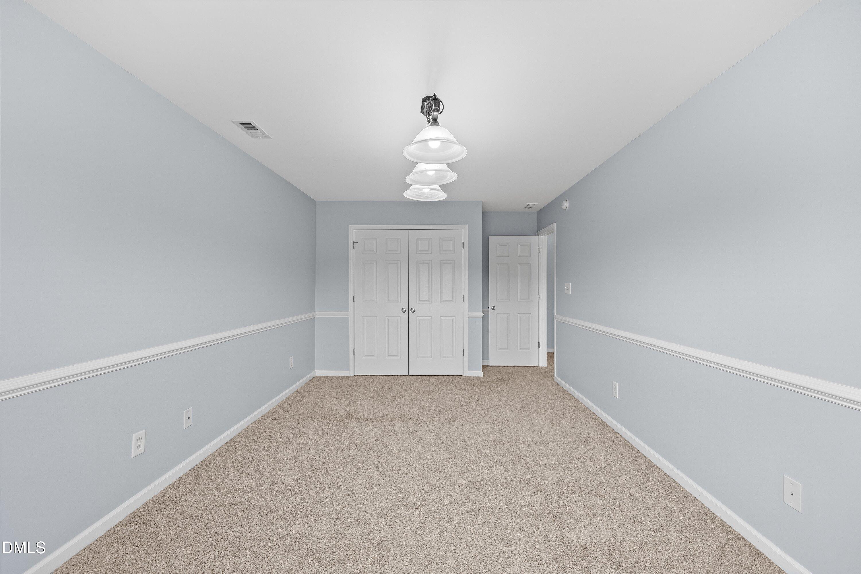 508 Arbor Crest Road Holly Springs, NC 27540 - Photo 27 of 45 a view of an empty room with a window