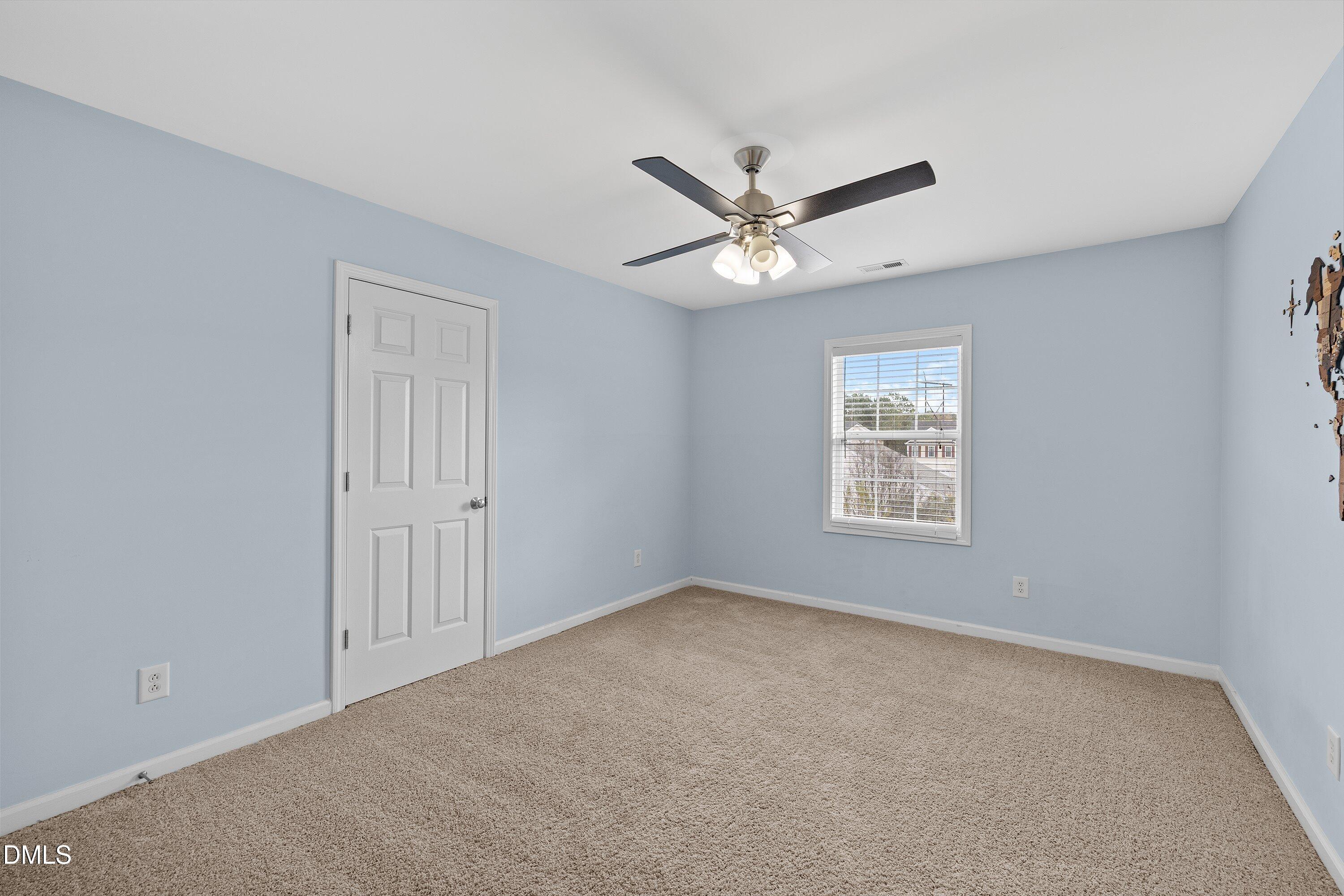 508 Arbor Crest Road Holly Springs, NC 27540 - Photo 28 of 45 a view of an empty room with a window