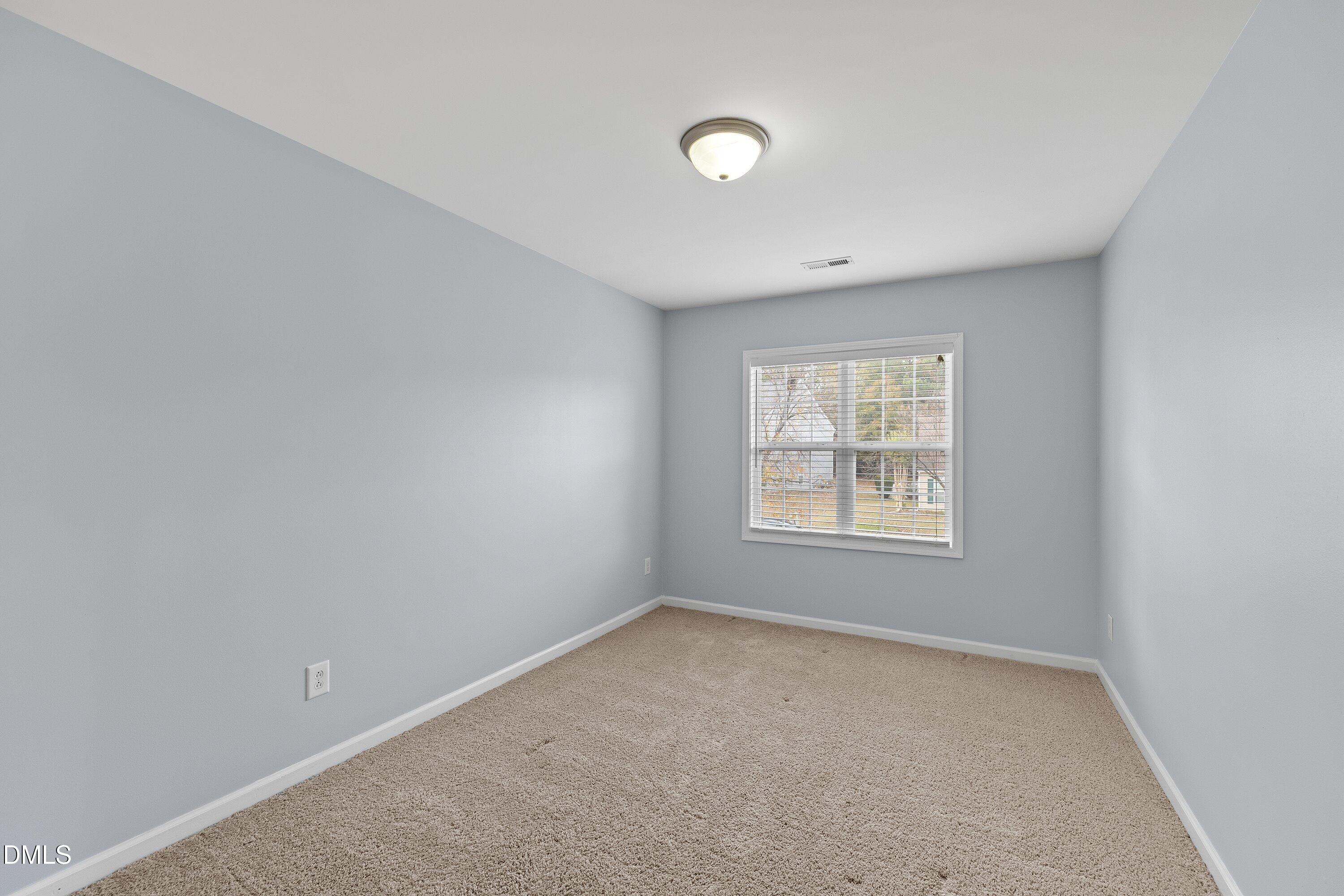 508 Arbor Crest Road Holly Springs, NC 27540 - Photo 38 of 45 an empty room with a window
