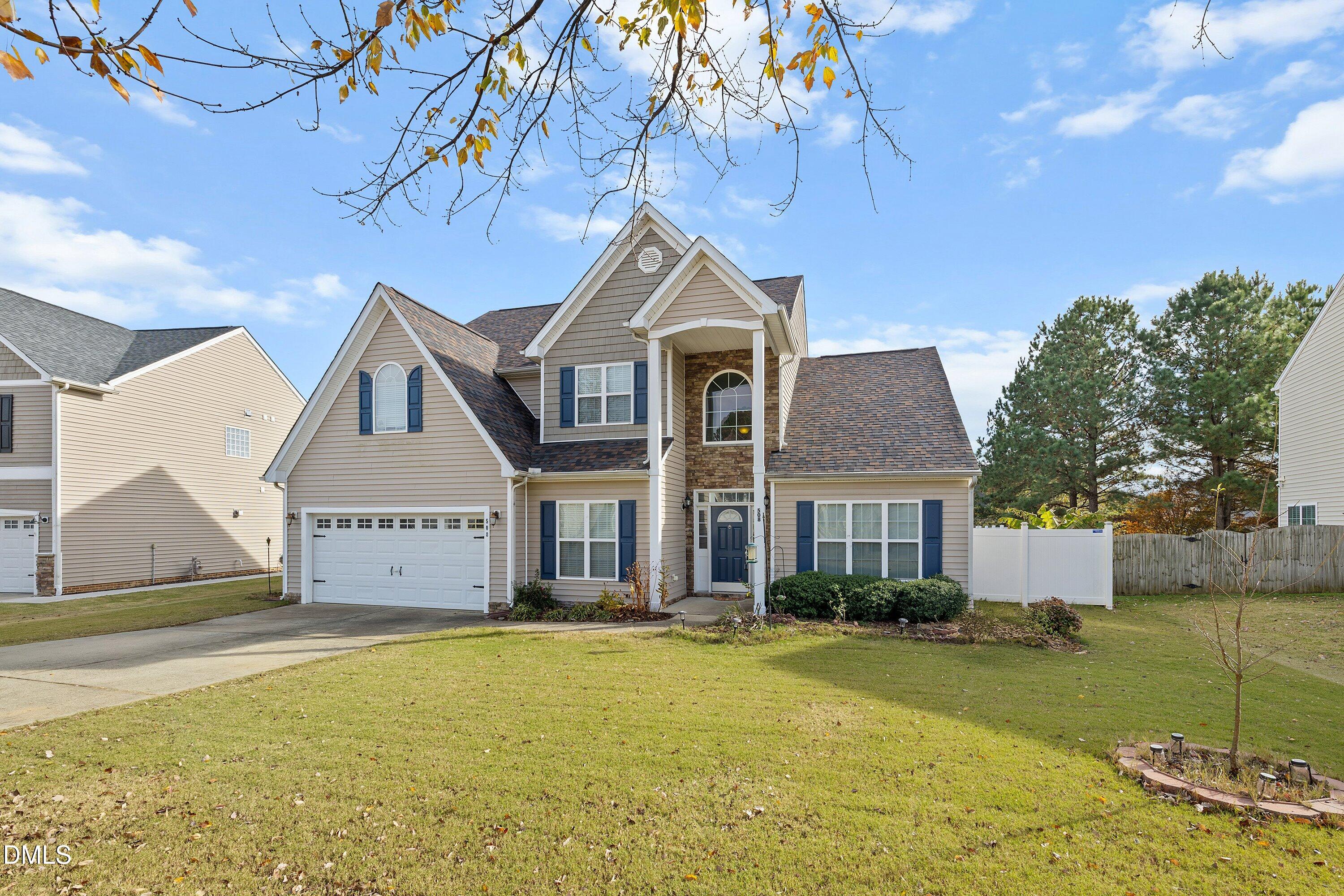 508 Arbor Crest Road Holly Springs, NC 27540 - Photo 4 of 45 a front view of a house with a yard