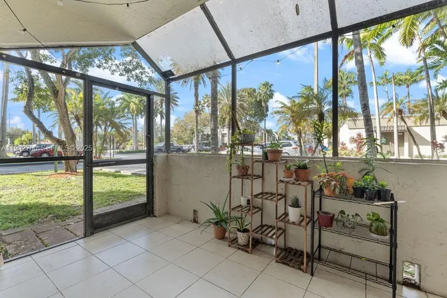 a room with lots of furniture and windows