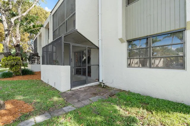 front view of a house with a fence