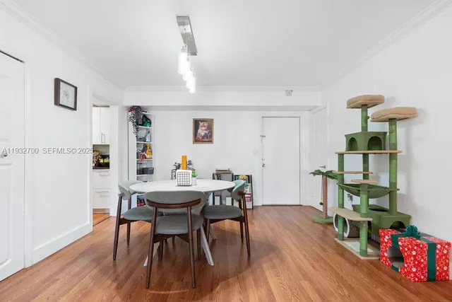 a view of a dining room with furniture and wooden floor