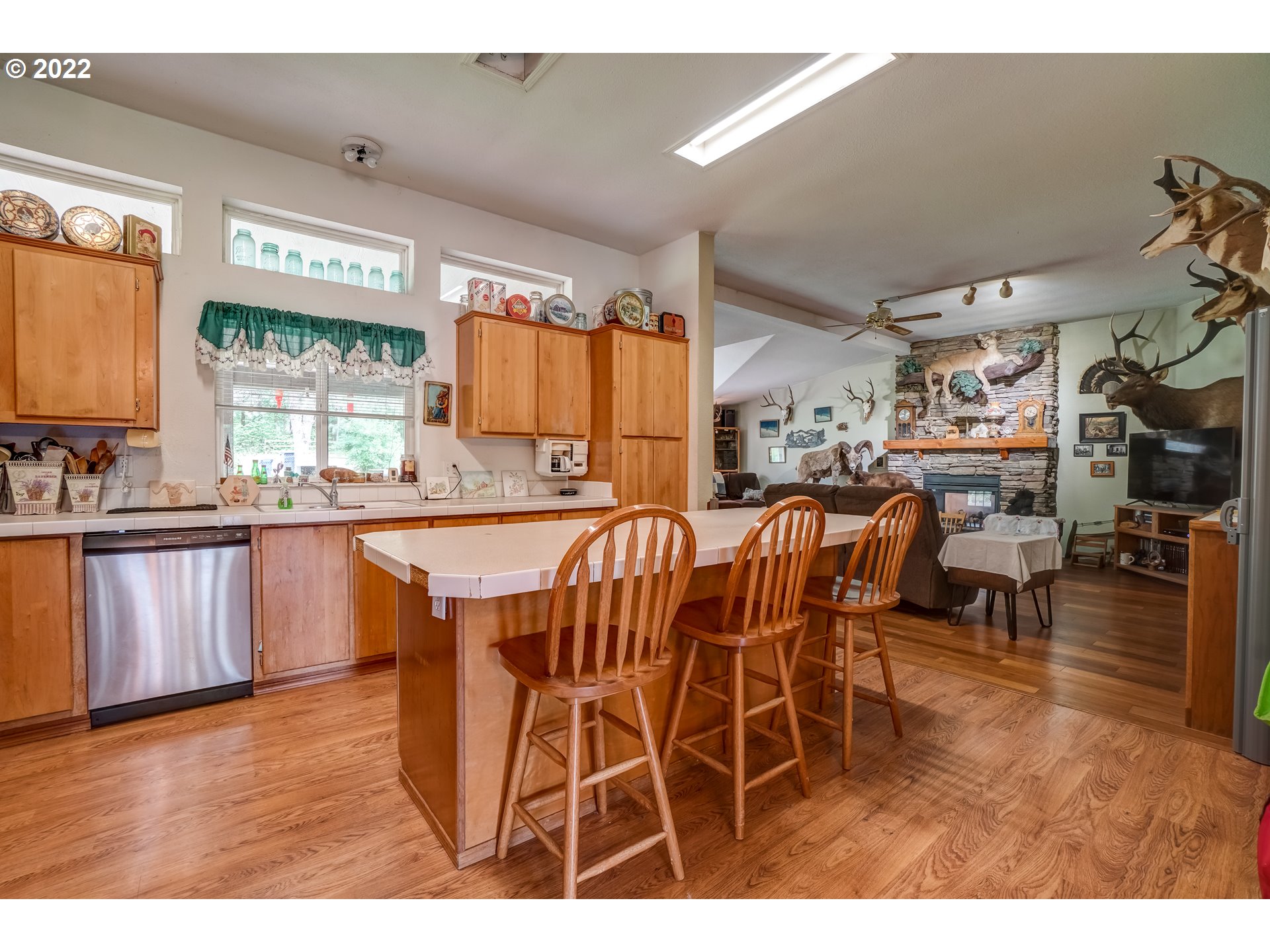 19887 South Ridge Road Oregon City, OR 97045 - Photo 13 of 26 a open kitchen with stainless steel appliances granite countertop a table chairs and a refrigerator