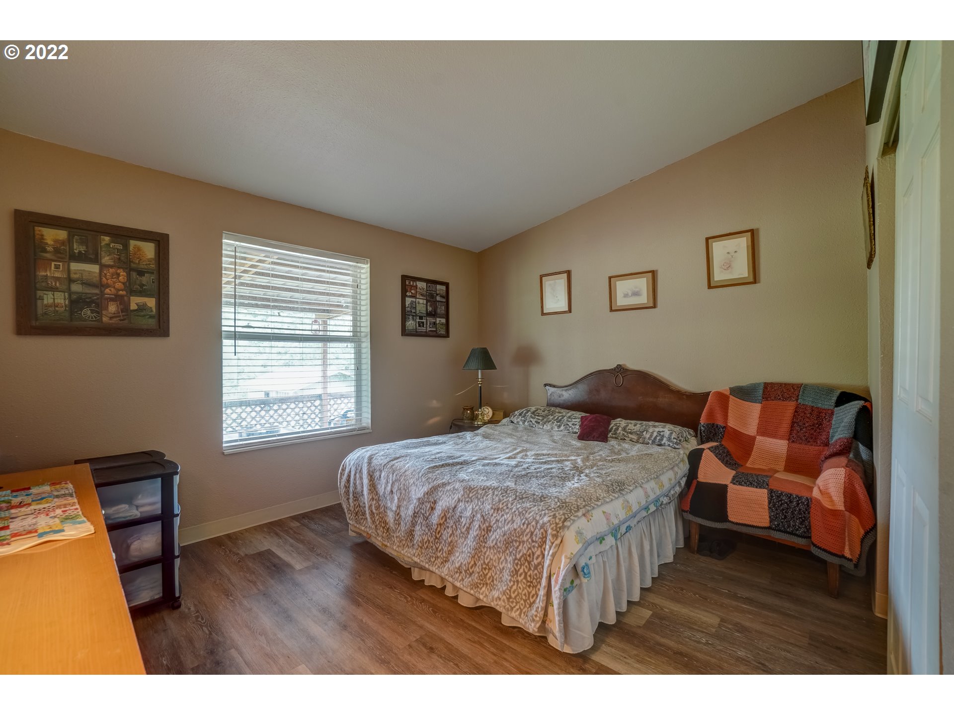 19887 South Ridge Road Oregon City, OR 97045 - Photo 14 of 26 a bedroom with a bed and wooden floor