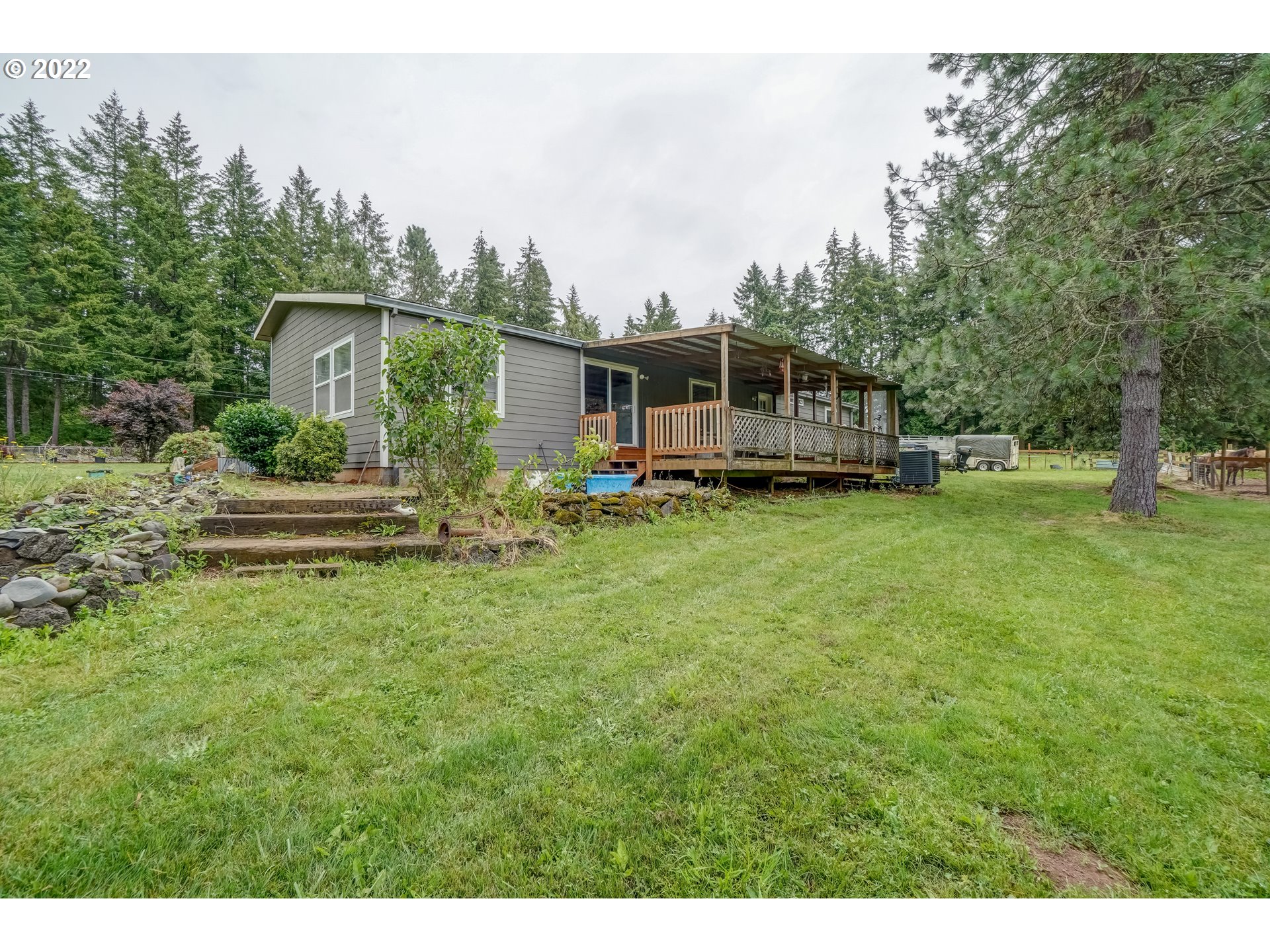 19887 South Ridge Road Oregon City, OR 97045 - Photo 3 of 26 a front view of a house with a yard