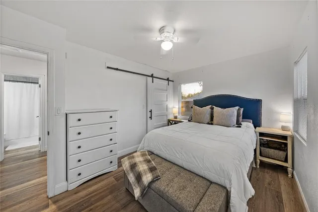 a bedroom with a bed and a tv