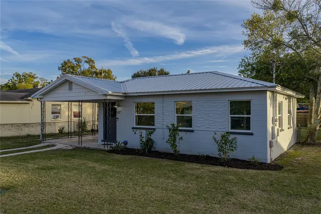 front view of a house with a yard