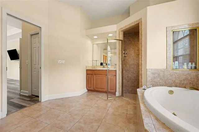a bathroom with a bathtub sink and window