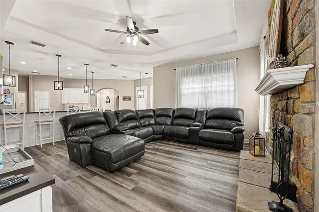a living room with furniture and a fireplace