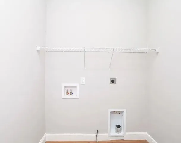 a bathroom with a shower and a sink