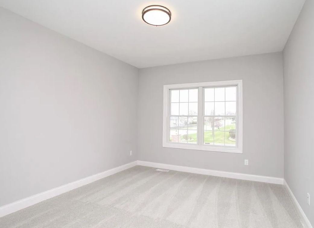 1 Saint Ivans Circle Bloomington, IL 61705 - Photo 21 of 29 an empty room with a window