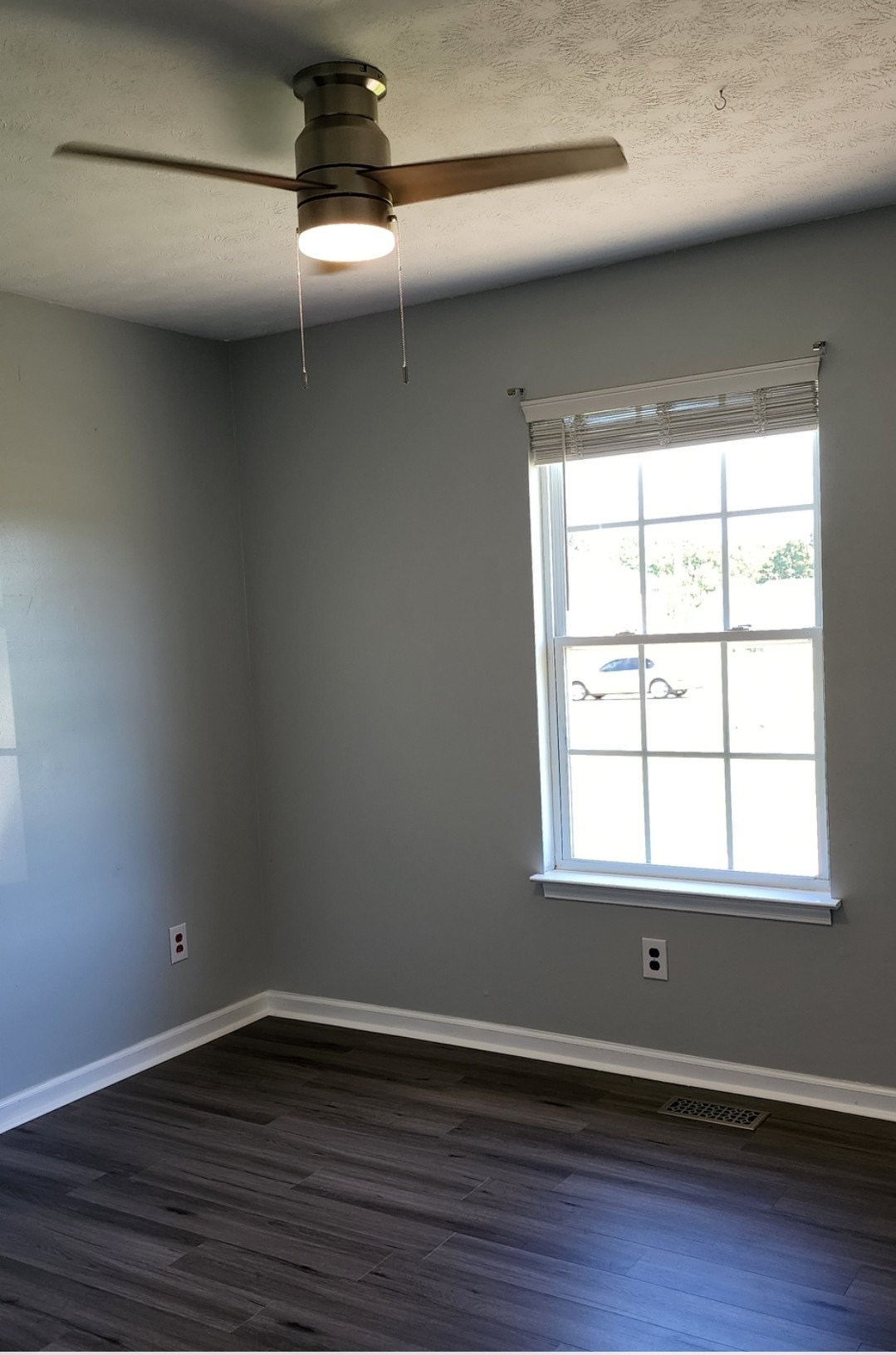 1368 Pomona Road Dickson, TN 37055 - Photo 17 of 24 a view of an empty room with wooden floor and a window